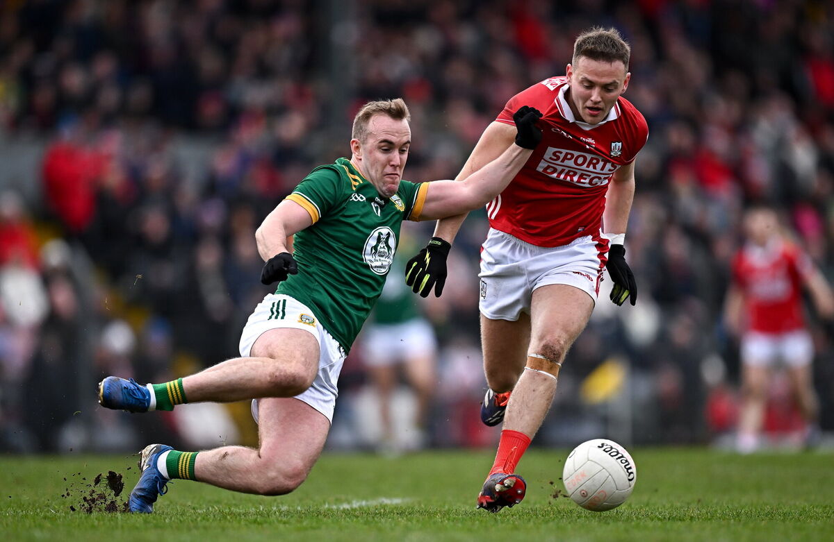 Ronan Ryan of Meath in action against Steven Sherlock of Cork. Picture: Seb Daly/Sportsfile