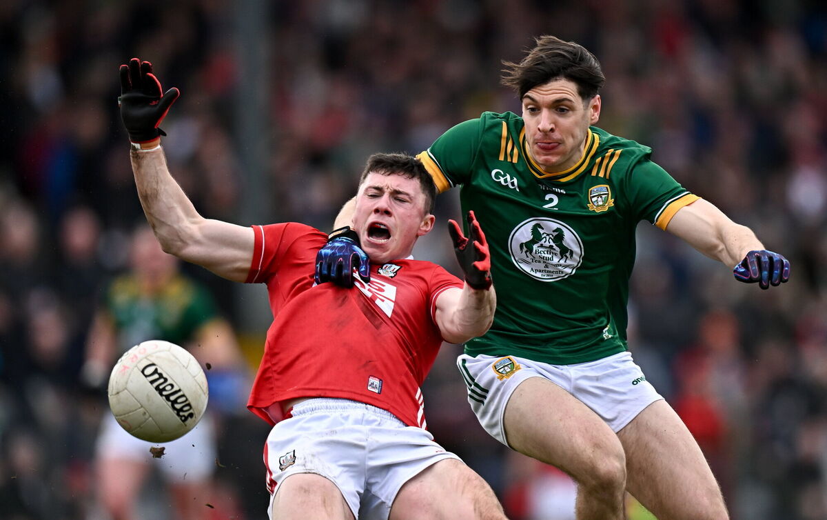Mark Cronin of Cork is fouled by Seamus Lavin of Meath. Picture: Seb Daly/Sportsfile