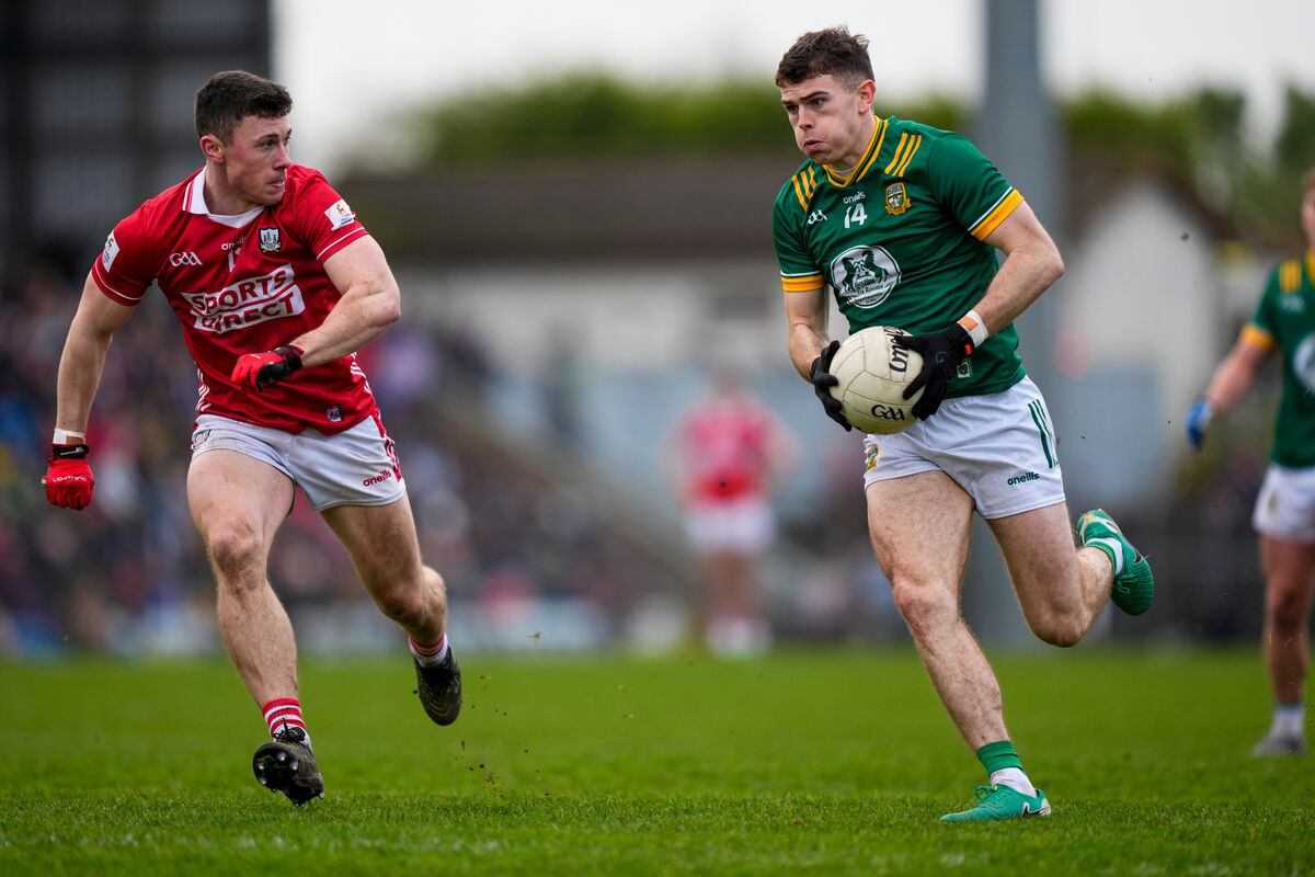 Eoghan Frayne of Meath and Mark Cronin of Cork in action. Picture: INPHO/James Lawlor