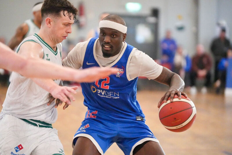 Tamyrik Fields of UCC Demons pushing past Finn Hughs of Limerick Celtics. Picture: Noel