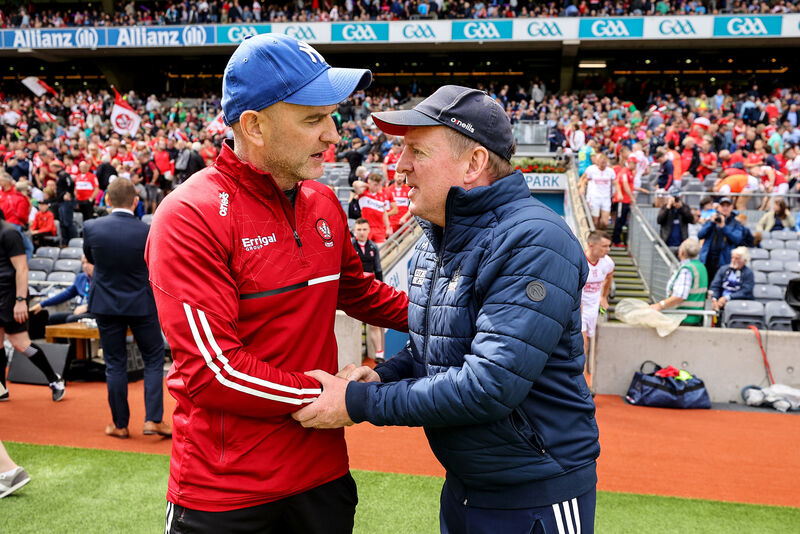 Derry manager Ciarán Meenagh shakes hands with Cork manager John Cleary. Picture: INPHO/Ben Brady