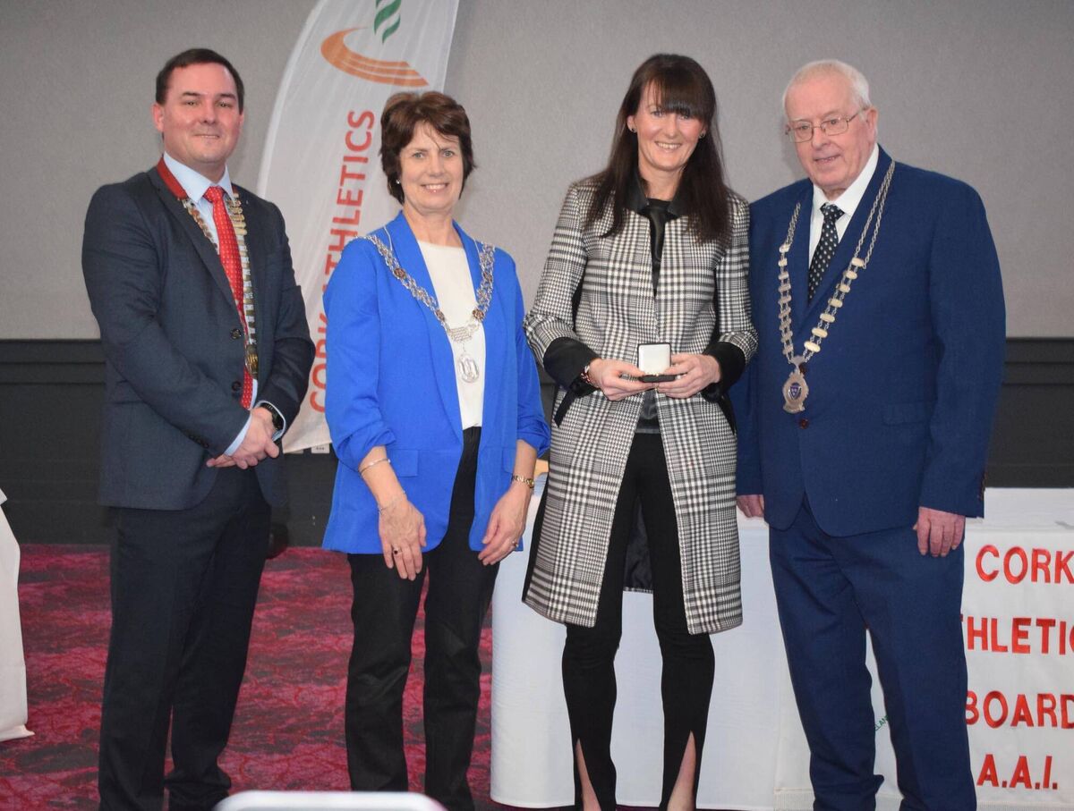 Michelle Kenny of Leevale receiving her international award. Also pictured are Michael Flynn, Chairperson Cork Athletics; Cllr Margaret McDonnell, Deputy Cork Lord Mayor; and Mossie Woulfe, President Munster Athletics. Picture: John Walshe 