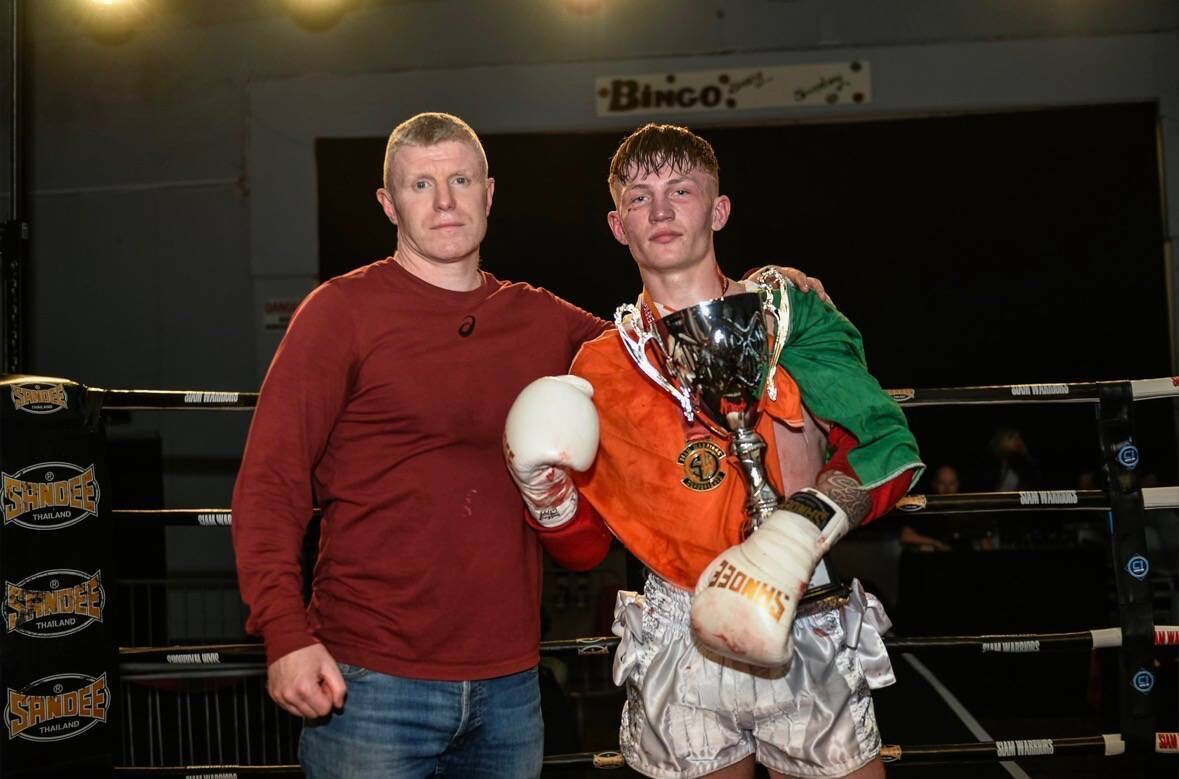 Colm O’Mahony with his coach Martin Horgan after beating Abdiel Gebrenigus from Finland at the Saim Warriors Super Fights event at the GUC Arena