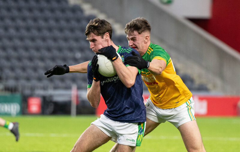 Glanmire's Daragh Murray holds on to the ball despite the challenge from Boherbue's Liam Moynihan two years ago. Picture: Howard Crowdy