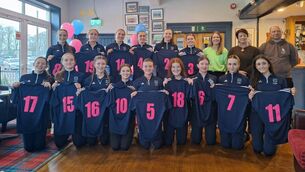 <p>The Scoil Mhuire team receive their jerseys from Ms Twomey (vice-principal) and Amy Nangle, 2023 captain, ahead of Wednesday’s So Hockey Munster Senior Cup final. Also included is Scoil Mhuire head coach, Dave Egner. Picture: Andrew Noonan</p>