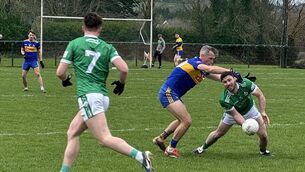 <p>Ballincollig's Rob Noonan gets his handpass off to Donnacha Desmond under pressure from Niall Coakley, Carrigaline, during their McCarthy Insurance Group Division 2 Football League game at Carrigaline.</p> <p>Ballincollig's Rob Noonan gets his handpass off to Donnacha Desmond under pressure from Niall Coakley, Carrigaline, during their McCarthy Insurance Group Division 2 Football League game at Carrigaline.</p>