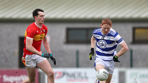 <p> Oisin O'Shea, Éire Óg, closes in on Jack Cahalane, Castlehaven at Ovens. Picture: Jim Coughlan.</p>