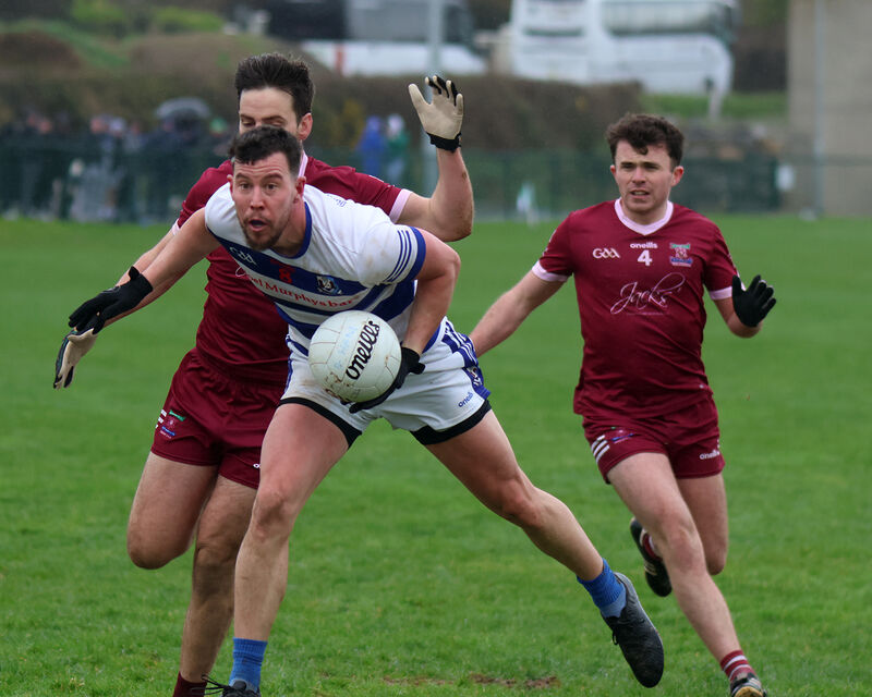 Troy O'Sullivan, Ballyphehane, in possession of the ball against Liam Walsh, Cromane. Picture: Brendan Gleeson