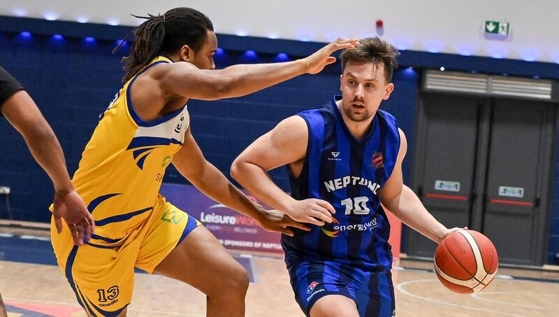 Neptune's Roy Downey is challenged by St Vincent's Denzel Ebose during their Men's Super League clash at the Neptune Stadium.