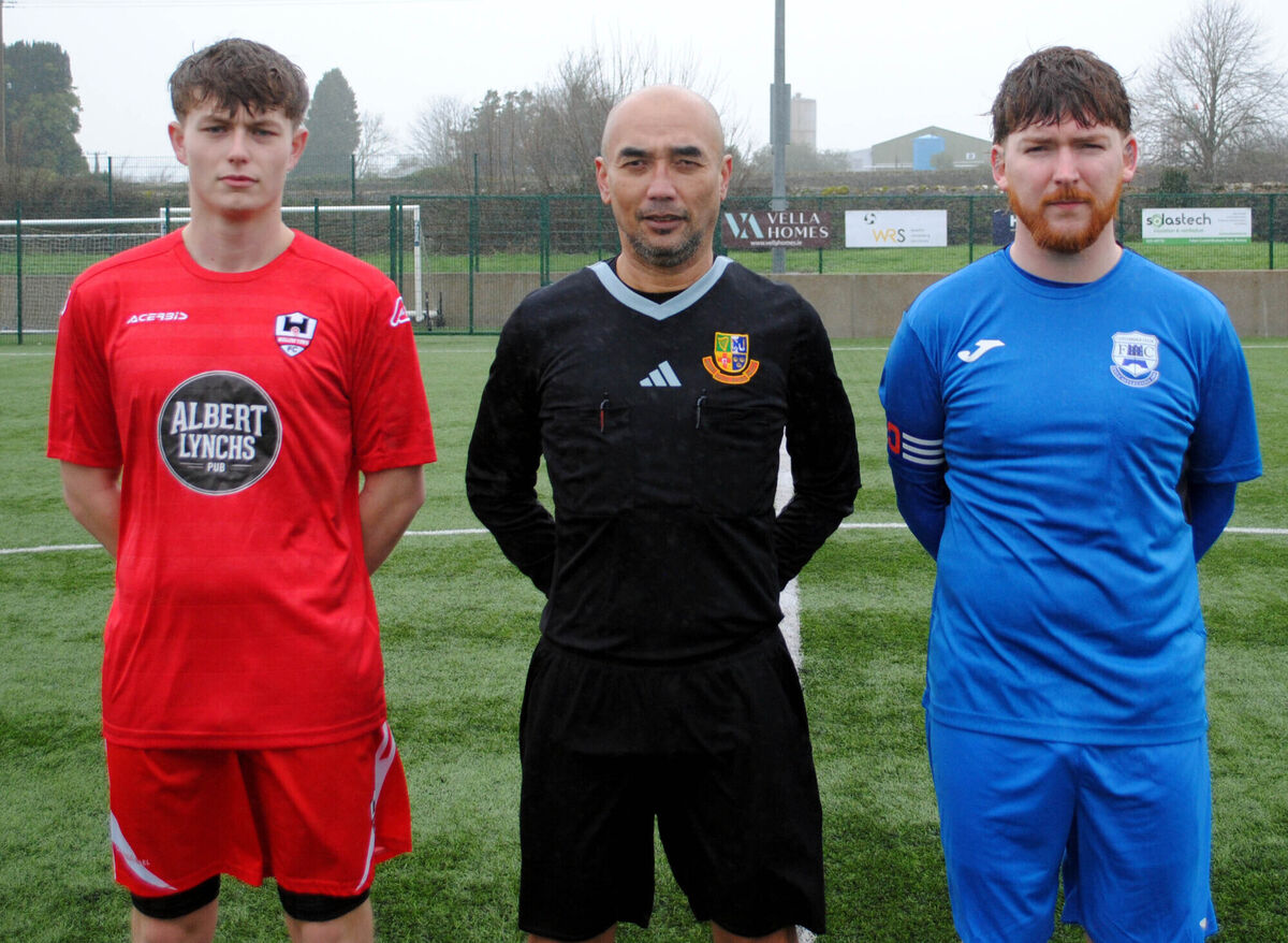 Castlebridge Celtic captain Cian O'Driscoll (right), with Mallow Town's Ryan O'Sullivan, accompanied by referee Sumate Virak. Picture: Barry Peelo. Castlebridge Celtic captain Cian O'Driscoll (right), with Mallow Town's Ryan O'Sullivan, accompanied by referee Sumate Virak. Picture: Barry Peelo.