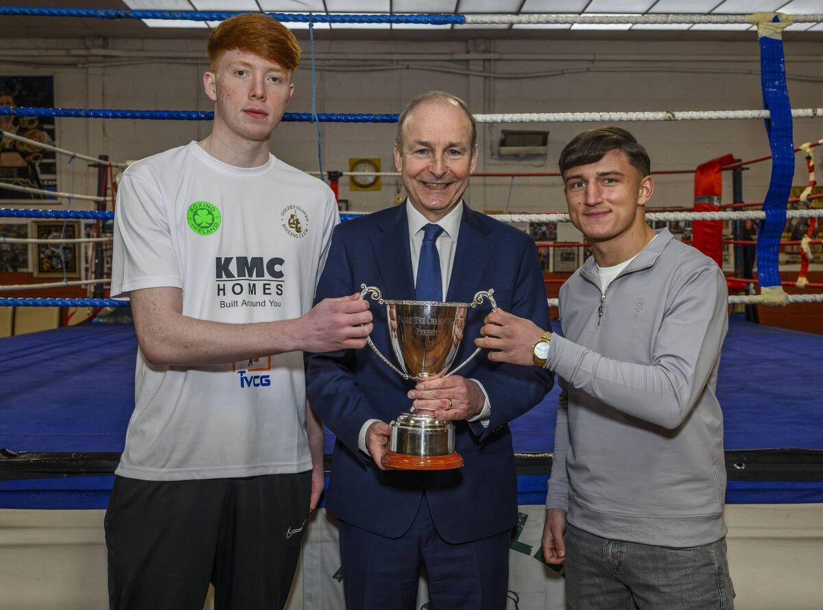 Taoiseach Micheál Martin pictured ringside at the Glen BC with Paddy 'The Champ' Martin Cup winners William Heaphy and Kuba Pielesz, both of Golden Gloves Boxing Club. Picture: Doug Minihane