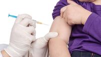 The doctor gave children vaccination needle