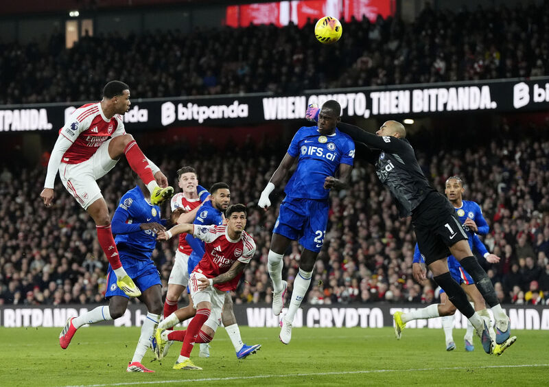 Chelsea's Trevoh Chalobah (centre) wins a head over Arsenal's Gabriel (left) and Chelsea goalkeeper Robert Sanchez (right) during the Premier League match at the Emirates Stadium, London. Picture: Nick Potts/PA Wire