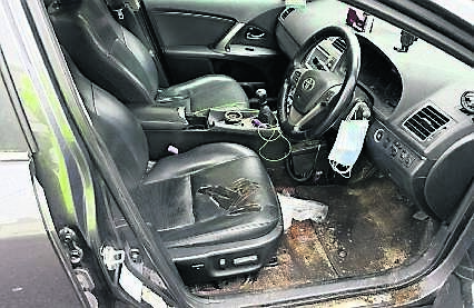 Pictured is the damaged and dirty interior of the unlicensed taxi seized in Douglas recently.