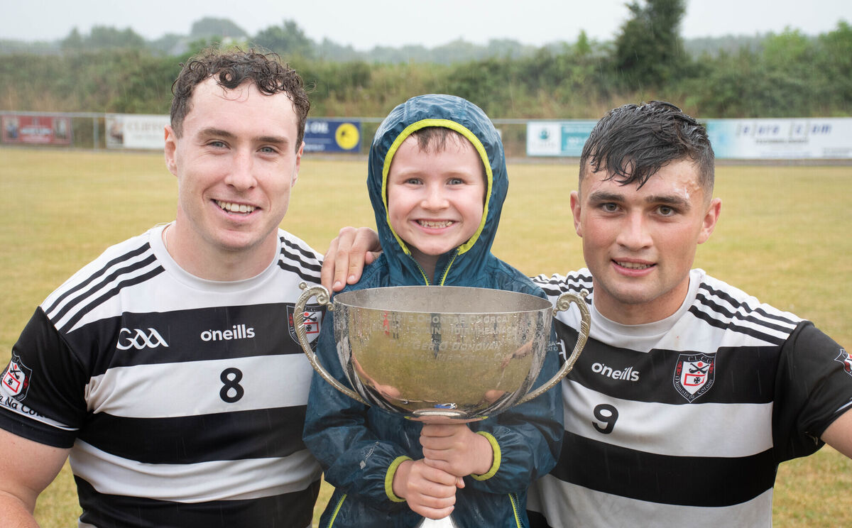 Mikey Finn (right) and Midleton team-mate Seán O'Meara with young fan Conor O'Reilly after the 2025 RedFM Hurling League Division 2 final win over Killeagh at Castlemartyr. Picture: Howard Crowdy