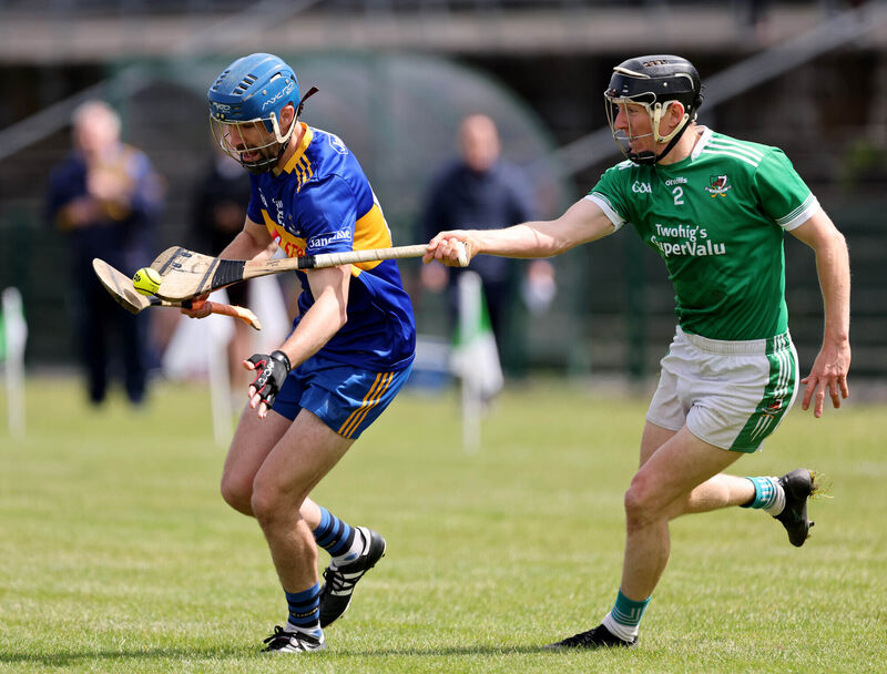 Brian Kelleher of Carrigaline tries to get away from Kanturk's John McLoughlin - the clubs were relegated from Division 1 last year and clash in the opening round of Division 2. Picture: Jim Coughlan