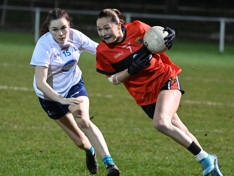 UCC's Niamh Martin breaks from TUD's Katie Murphy during the AIG Ladies HEC O'Connor Cup semi-final at The Mardyke. Picture: Eddie O'Hare