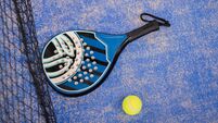 Close up padel or tennis racket and balls