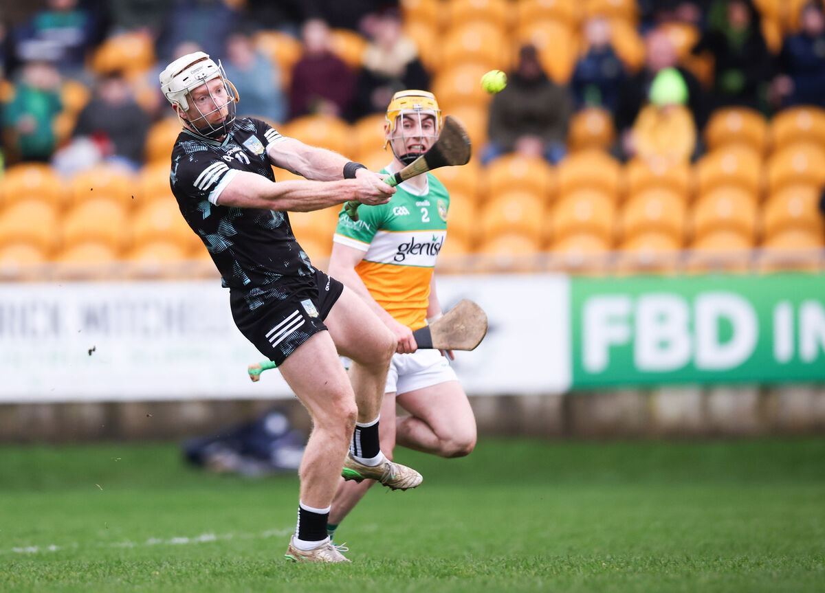 Limerick's Cian Lynch shoots from Patrick Taaffe of Offaly. Picture: INPHO/Tom Maher