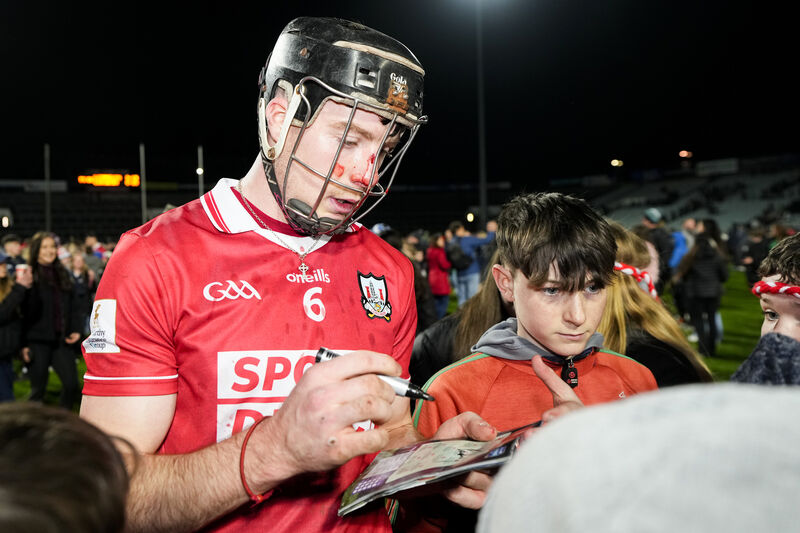 Eoin Downey of Cork signs autographs for young fans after the loss to Limerick. Picture: INPHO/James Lawlor