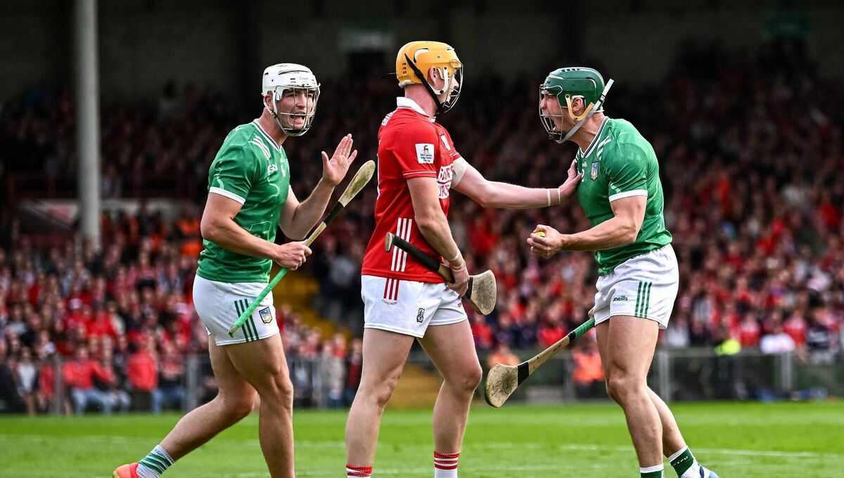 Limerick players Seán Finn, right, and Kyle Hayes celebrate winning a free against Shane Barrett of Cork last season. Picture: Piaras Ó Mídheach/Sportsfile