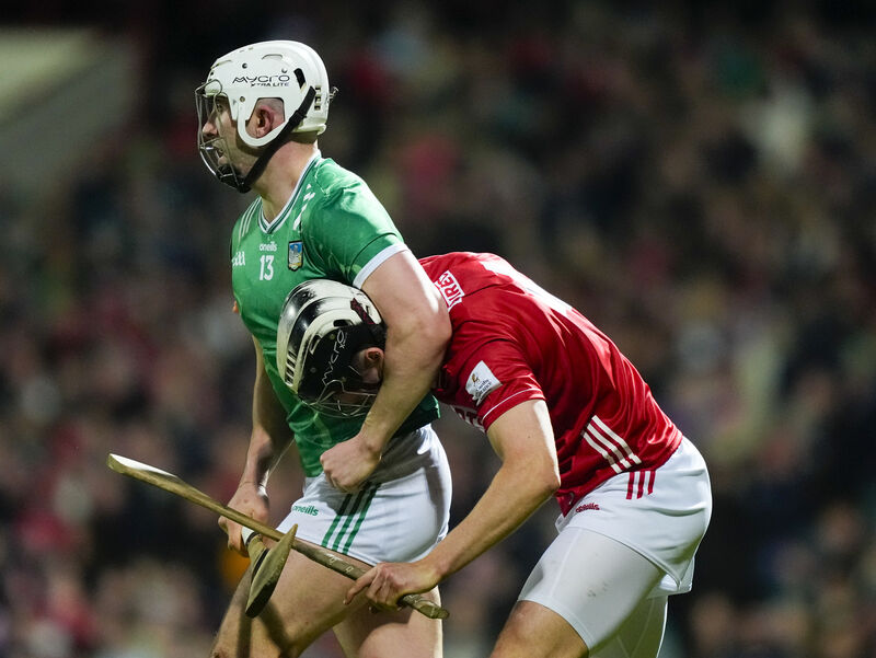 Aaron Gillane of Limerick and Ger Millerick of Cork tussle before the sliotar is sent in. Picture: INPHO/James Lawlor