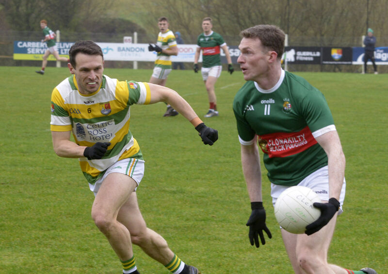Carbery Rangers' John O'Rourke looks to stop the run of Dara Ó Sé of Clonakilty. Picture: Denis Boyle