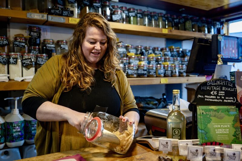 Steph Ayres pictured serving a customer at Gather Community Grocery in Ballinspittle, as she expands her community-focused food initiative with a new mobile grocer. picture Chani Anderson
