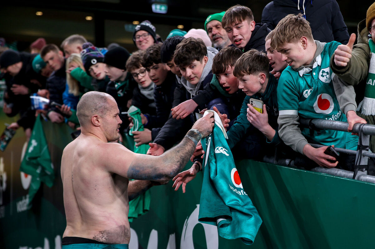 Ireland's Jacob Stockdale gives his jersey to a young fan after the Wales win. Picture: INPHO/Ben Brady